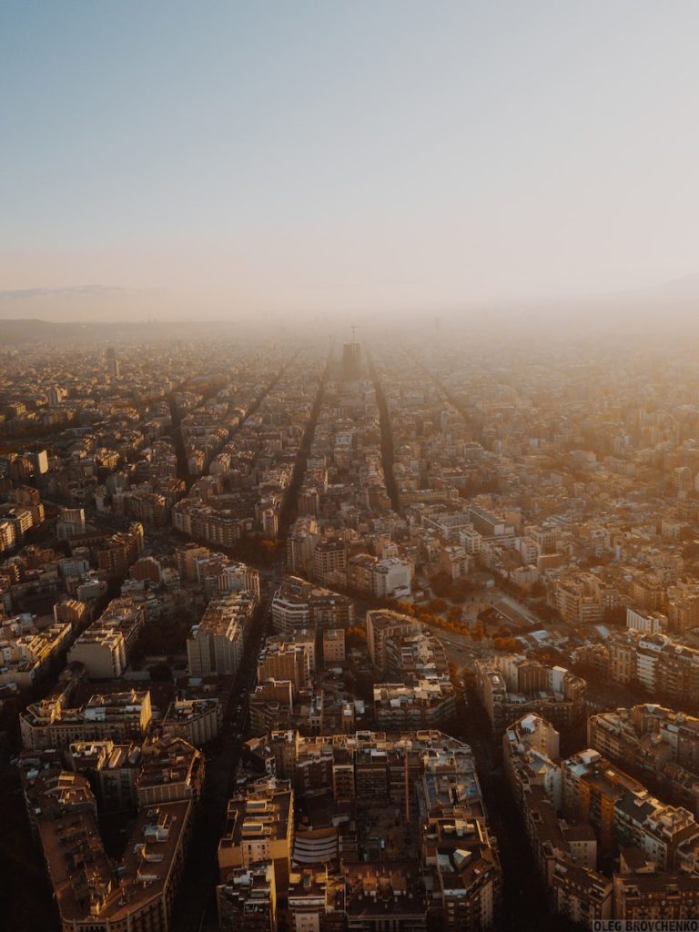 an aerial view of a city with tall buildings